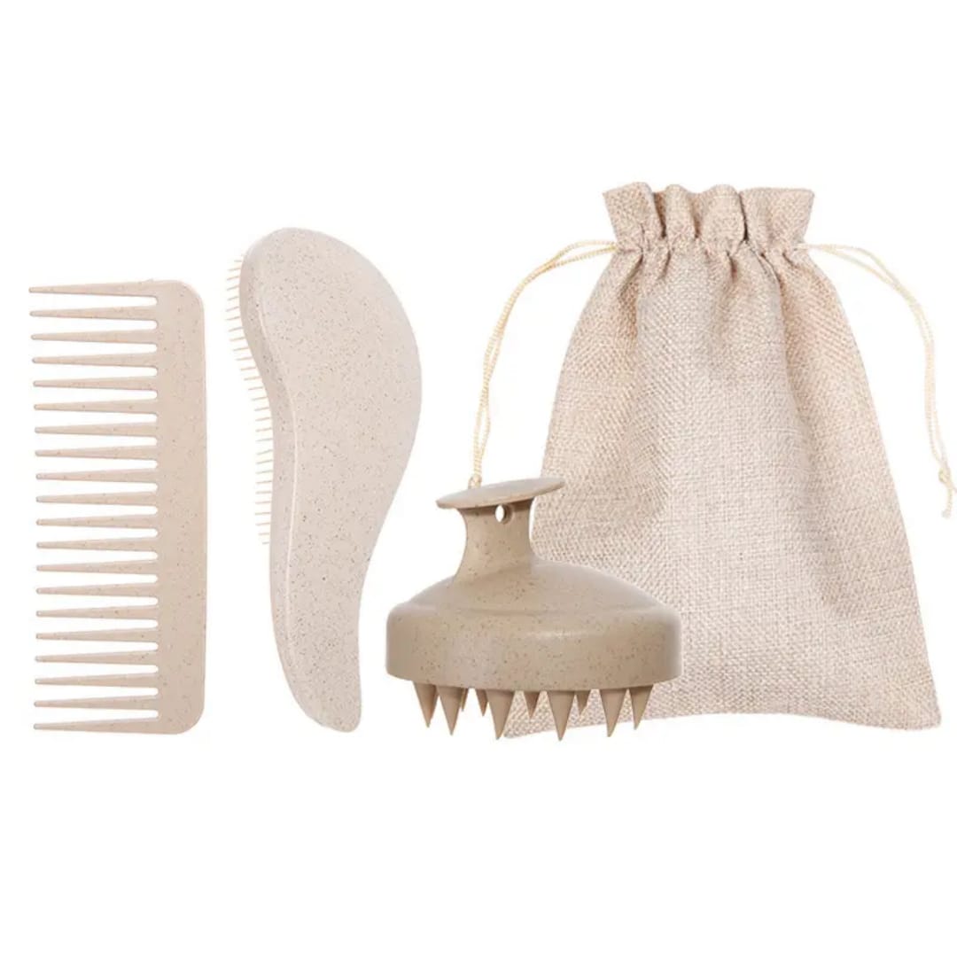 Set of hair care tools including a comb, brush, and massage tool with a drawstring bag on a white background.